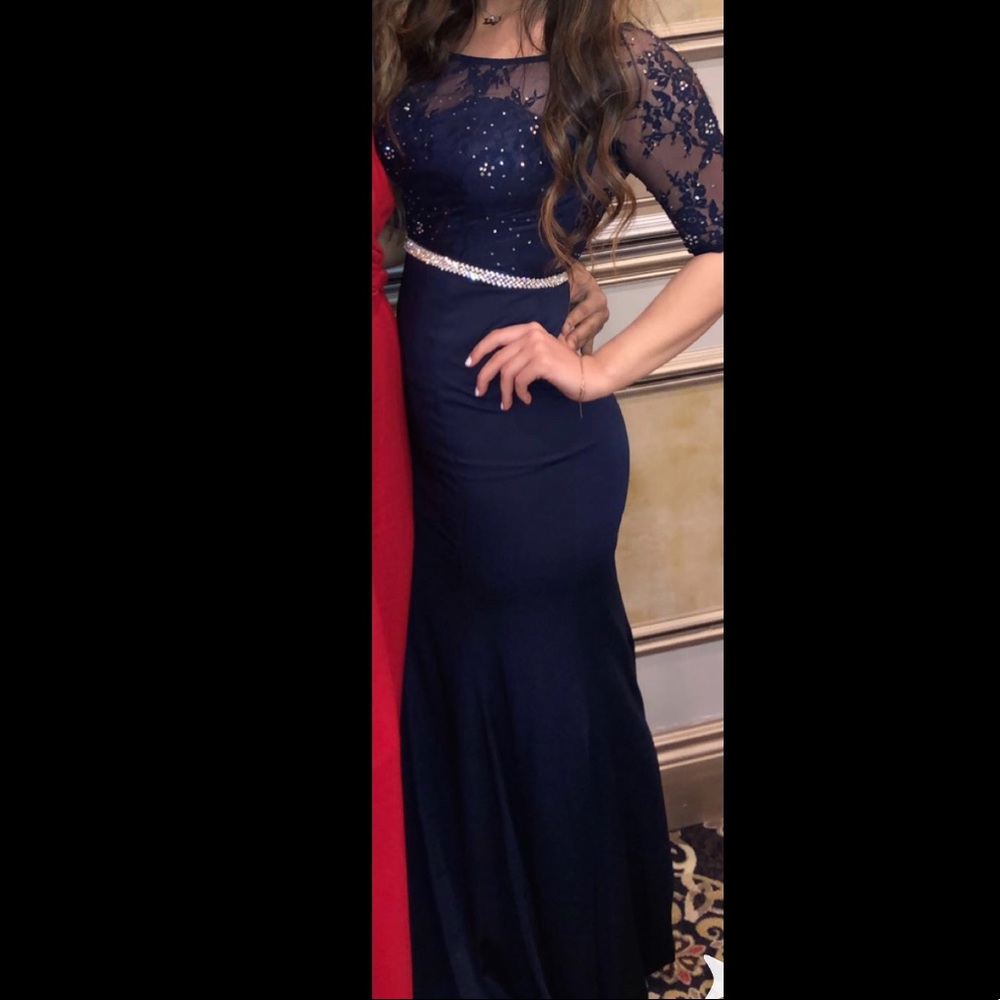 No sign of wear. Blue long elegant dress.